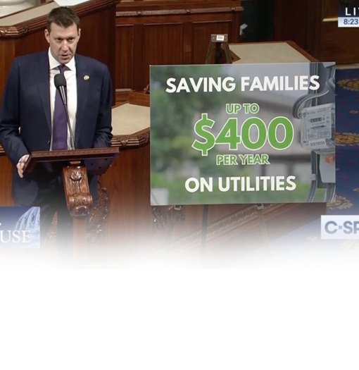 JR gives floor speech next to sign about lowering utility costs